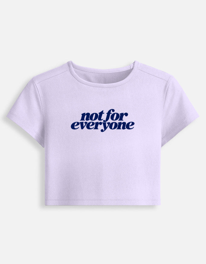 A light lavender short-sleeve crop top t-shirt with the text 'not for everyone' printed in navy blue across the chest, displayed on a clean off-white background.