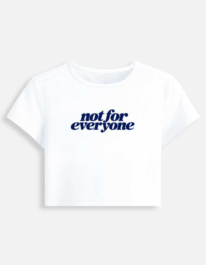 A white short-sleeve crop top t-shirt featuring the text 'not for everyone' printed in a dark navy blue script font across the chest, displayed on a light gray background.