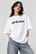 A woman wearing an oversized white graphic T-shirt, shown from the back. The shirt features a large black and blue comic-style explosion graphic with the text 'DO WHAT YOU LOVE, JAY WILL FOLLOW' and the number 8.