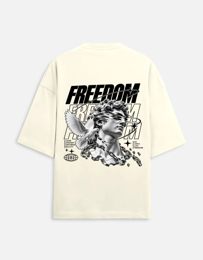 An off-white short-sleeve t-shirt shown from the back, featuring a large black graphic print of a classical statue head with a winged figure, the word 'FREEDOM' in bold letters, and small text reading 'SPECIAL EDITION'.