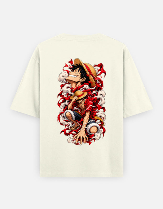 An off-white short-sleeve t-shirt with a large, colorful graphic print of the anime character Luffy from One Piece on the back, displayed against a light gray background.