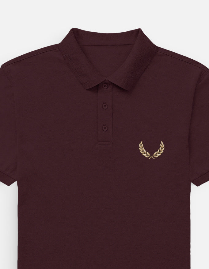 Brown polo shirt with 'DEFINED' logo on a white background