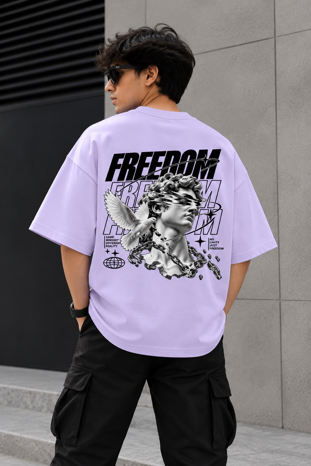 Model wearing purple oversized Freedom graphic streetwear t-shirt back 