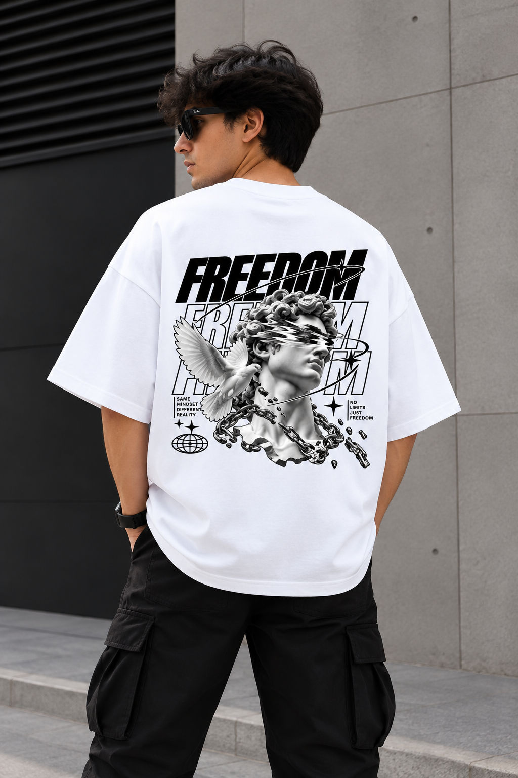 Model wearing white oversized Freedom graphic streetwear t-shirt back 