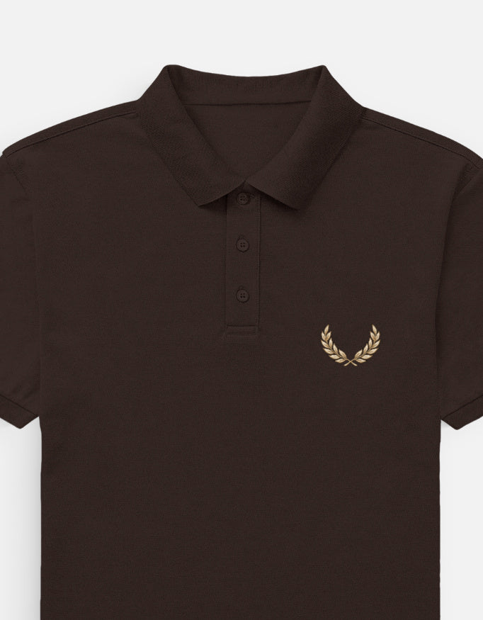 Brown polo shirt with 'DEFINED' logo on a white background